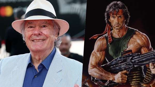 Retrato de Renato Casaro junto al póster de Rambo III – Imagen icónica del ilustrador italiano con una de sus obras más famosas.
