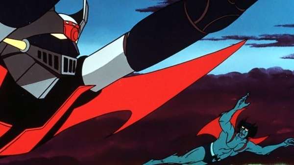 : Mazinger Z y Devilman vuelan sobre una ciudad en ruinas mientras enfrentan monstruos gigantes en el póster clásico del film.
