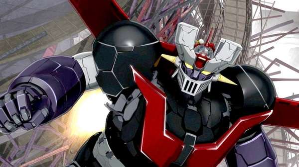 Mazinger Z volando en plena batalla, rodeado de explosiones y energía luminosa durante una secuencia de combate.