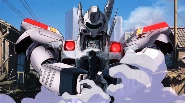 Póster oficial de Patlabor: The Movie con la policía y los robots Labors en composición heroica sobre un fondo urbano futurista.