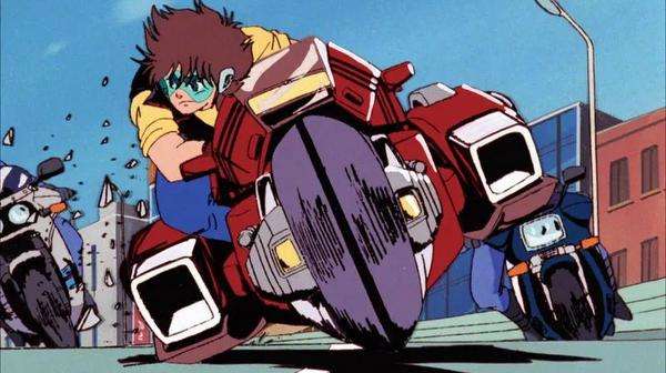 Escena de acción de Megazone 23 con el protagonista conduciendo una motocicleta a gran velocidad